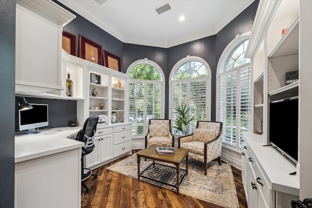 59 N Berryline Cir, Spring, TX 77381 - office area featuring plenty of natural light, dark wood finished floors, built in desk, and ornamental molding