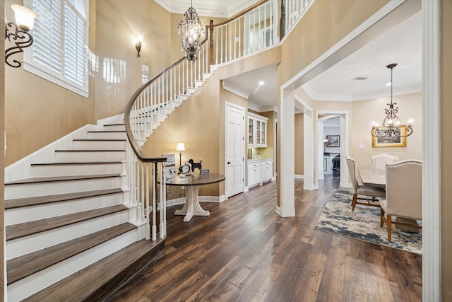 59 N Berryline Cir, Spring, TX 77381 - entryway with a chandelier, stairs, dark wood-type flooring, ornamental molding, and a towering ceiling