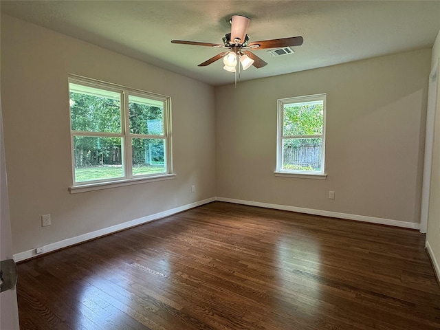 6202 Simsdale St, Houston, TX 77087 - unfurnished room featuring healthy amount of natural light, dark wood-style flooring, and ceiling fan