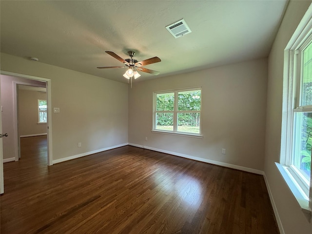6202 Simsdale St, Houston, TX 77087 - spare room featuring healthy amount of natural light, ceiling fan, and dark wood finished floors