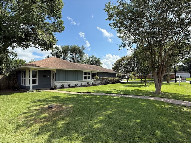 6202 Simsdale St, Houston, TX 77087 - view of front of home featuring a front yard, brick siding, and a shingled roof