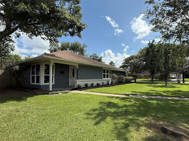 6202 Simsdale St, Houston, TX 77087 - ranch-style house featuring a front yard, a shingled roof, and brick siding