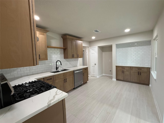 6202 Simsdale St, Houston, TX 77087 - kitchen featuring stainless steel dishwasher, tasteful backsplash, light stone countertops, recessed lighting, and stove
