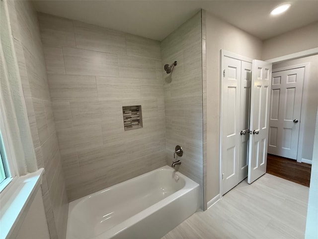 6202 Simsdale St, Houston, TX 77087 - bathroom with washtub / shower combination, wood finished floors, and recessed lighting