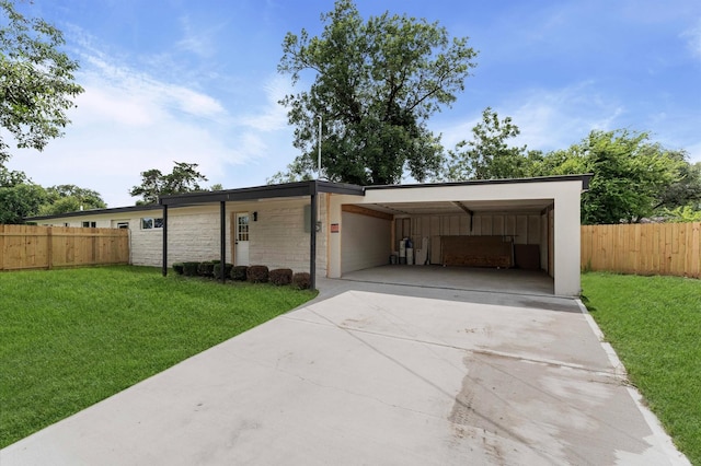 200 Burnett Dr, Baytown, TX 77520 - garage with driveway and an attached carport