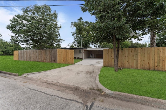 200 Burnett Dr, Baytown, TX 77520 - view of front of property with concrete driveway and a carport