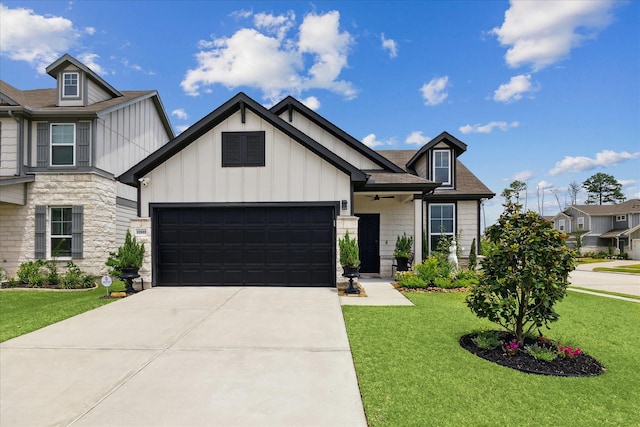 23502 Glenbuck St, Spring, TX 77373 - view of front of property with a front yard, board and batten siding, a garage, concrete driveway, and stone siding