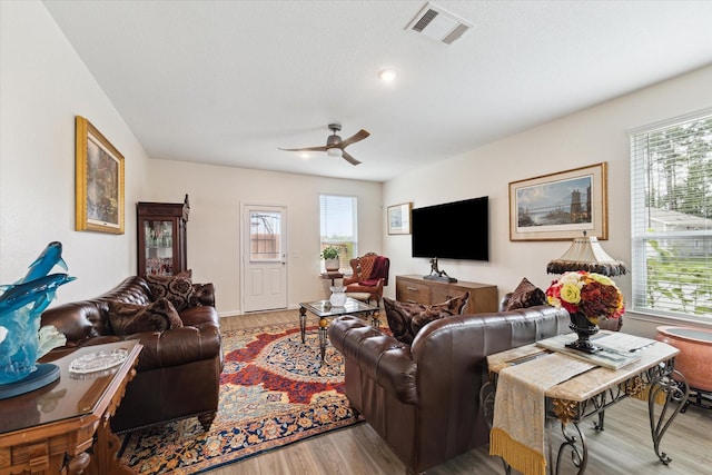 23502 Glenbuck St, Spring, TX 77373 - living area featuring ceiling fan, light wood finished floors, and plenty of natural light