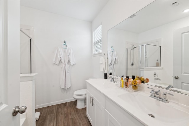 23502 Glenbuck St, Spring, TX 77373 - full bathroom featuring a shower stall, double vanity, and wood finished floors