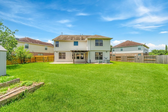 18203 Park Sage Ct, Cypress, TX 77433 - back of house with a patio area, a garden, and a fenced backyard