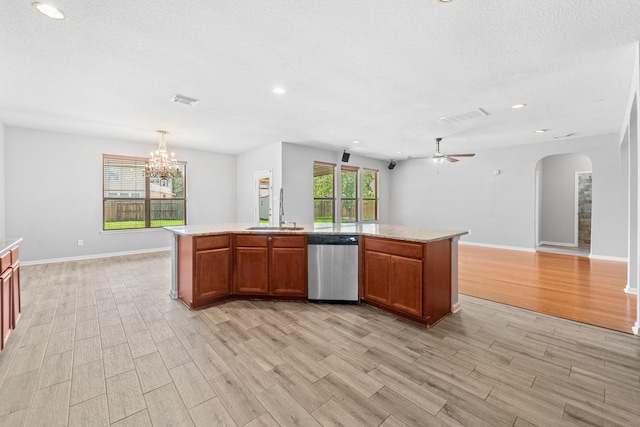 18203 Park Sage Ct, Cypress, TX 77433 - kitchen with dishwasher, light wood-style flooring, arched walkways, a ceiling fan, and a chandelier