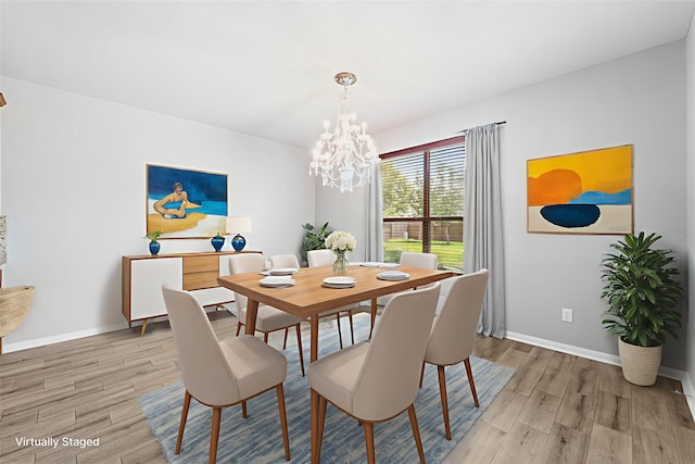 18203 Park Sage Ct, Cypress, TX 77433 - dining room with light wood-style floors and a chandelier