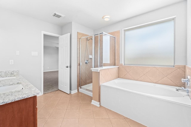 18203 Park Sage Ct, Cypress, TX 77433 - full bath featuring a bath, tile patterned flooring, a stall shower, and double vanity