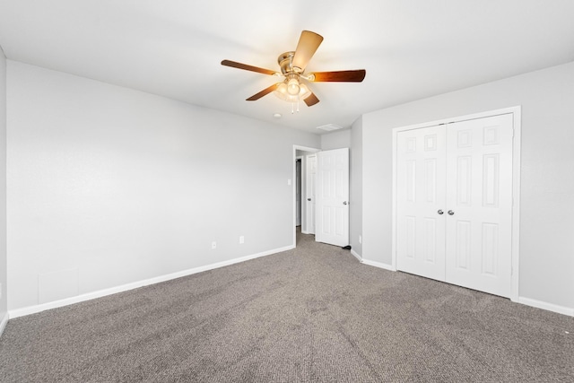 18203 Park Sage Ct, Cypress, TX 77433 - unfurnished bedroom with carpet, a closet, and a ceiling fan