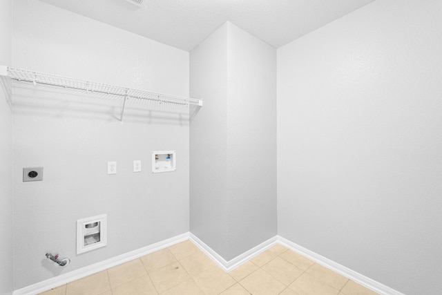18203 Park Sage Ct, Cypress, TX 77433 - washroom featuring hookup for a gas dryer, hookup for a washing machine, electric dryer hookup, and light tile patterned floors