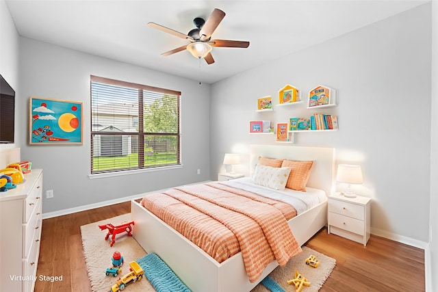 18203 Park Sage Ct, Cypress, TX 77433 - bedroom with light wood-type flooring and ceiling fan