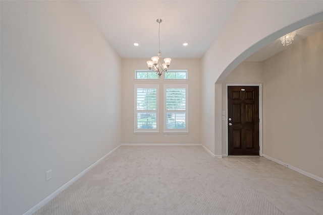 19911 Whistle Creek Ln, Cypress, TX 77433 - unfurnished room with a chandelier, arched walkways, recessed lighting, and light carpet