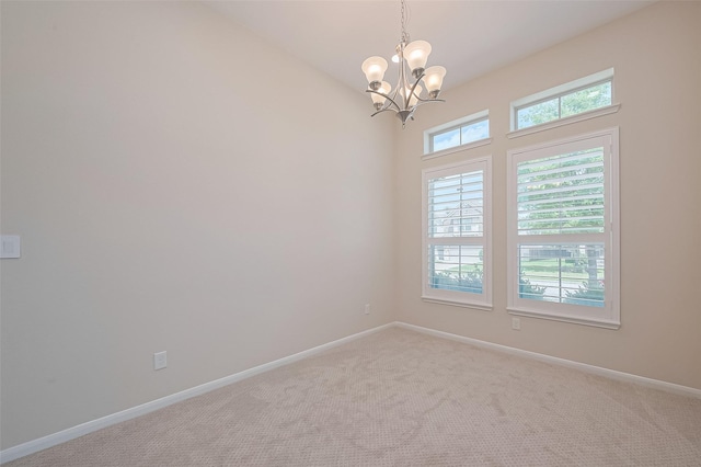 19911 Whistle Creek Ln, Cypress, TX 77433 - empty room featuring a chandelier and carpet flooring