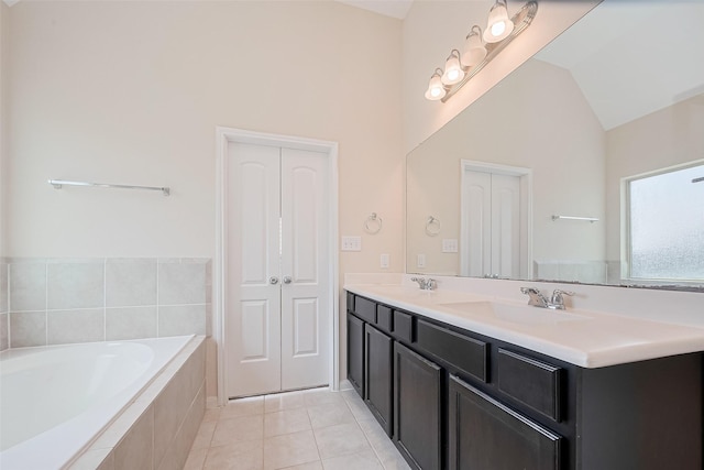19911 Whistle Creek Ln, Cypress, TX 77433 - full bath featuring double vanity, a bath, lofted ceiling, and tile patterned floors