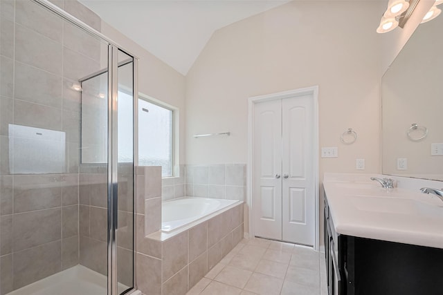 19911 Whistle Creek Ln, Cypress, TX 77433 - full bath featuring vaulted ceiling, a shower stall, a bath, double vanity, and tile patterned flooring