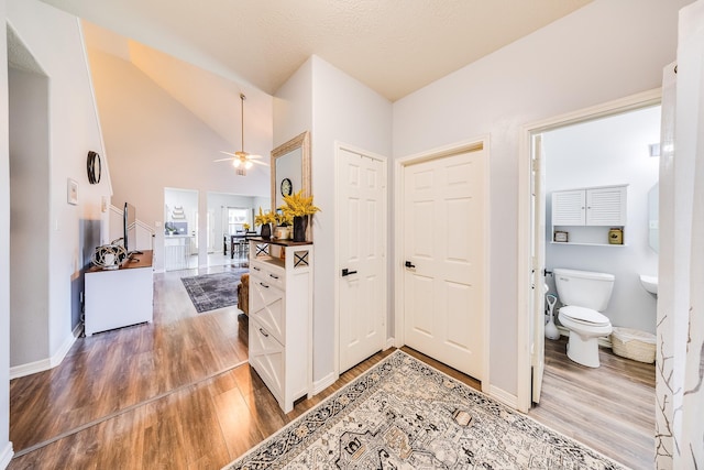 10627 Fire Sage Dr, Humble, TX 77396 - hall with light wood-type flooring and high vaulted ceiling