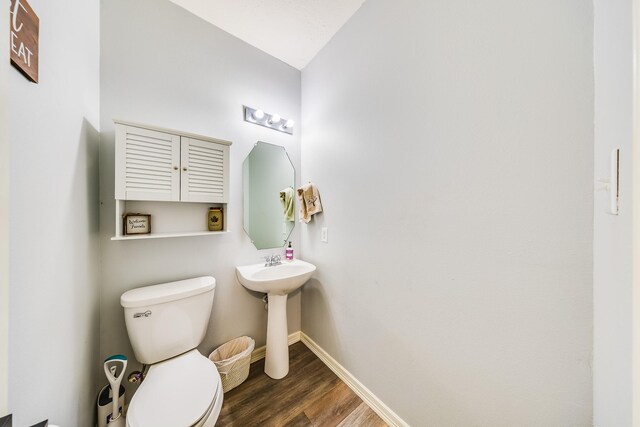 10627 Fire Sage Dr, Humble, TX 77396 - half bathroom featuring toilet and wood finished floors