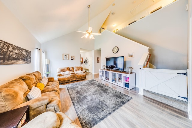 10627 Fire Sage Dr, Humble, TX 77396 - living area featuring wood finished floors, high vaulted ceiling, and ceiling fan
