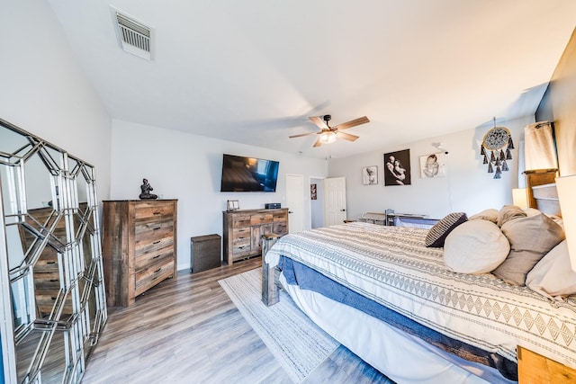 10627 Fire Sage Dr, Humble, TX 77396 - bedroom with light wood finished floors and a ceiling fan