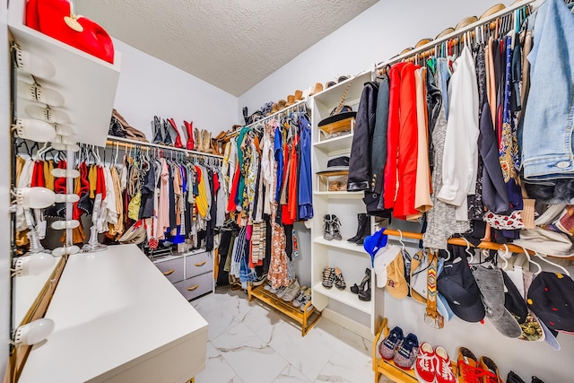 10627 Fire Sage Dr, Humble, TX 77396 - spacious closet featuring light marble finish floors