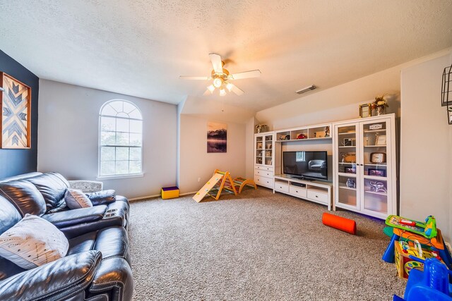 10627 Fire Sage Dr, Humble, TX 77396 - living room with carpet floors, ceiling fan, and a textured ceiling