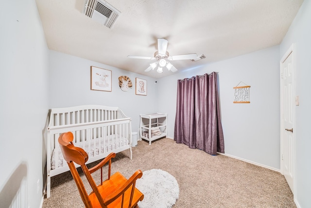 10627 Fire Sage Dr, Humble, TX 77396 - carpeted bedroom with a ceiling fan and a crib