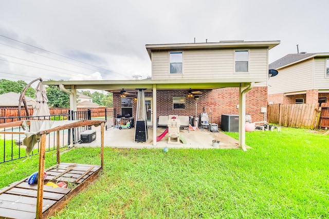 10627 Fire Sage Dr, Humble, TX 77396 - back of house featuring ceiling fan, a fenced backyard, brick siding, and a patio area