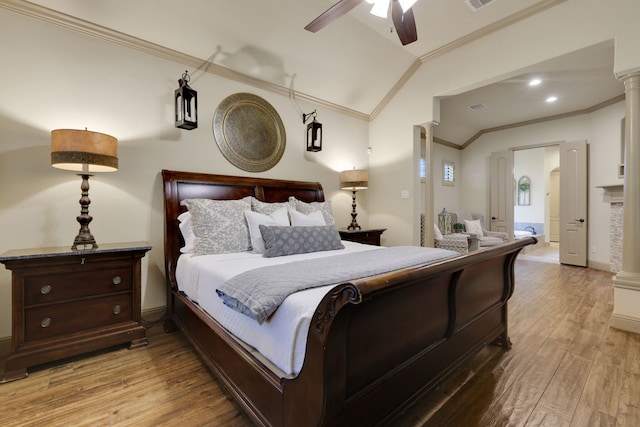 21311 Fairhaven Meadow Dr, Cypress, TX 77433 - bedroom with crown molding, vaulted ceiling, light wood-style floors, and a ceiling fan