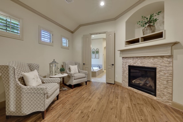 21311 Fairhaven Meadow Dr, Cypress, TX 77433 - sitting room with light wood-type flooring, ornamental molding, a fireplace, and recessed lighting