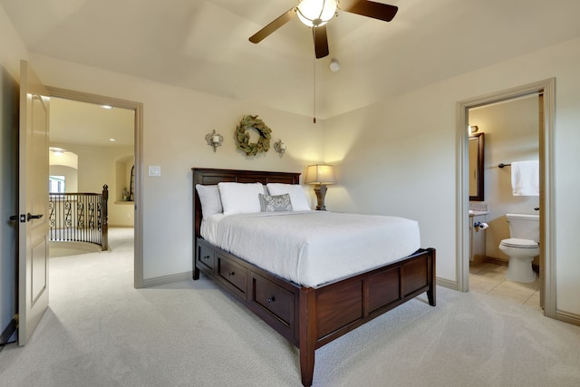 21311 Fairhaven Meadow Dr, Cypress, TX 77433 - bedroom featuring light colored carpet, arched walkways, connected bathroom, lofted ceiling, and a ceiling fan