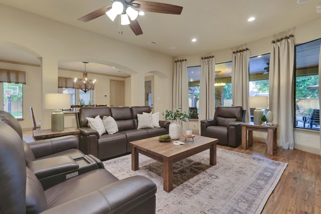 21311 Fairhaven Meadow Dr, Cypress, TX 77433 - living area featuring arched walkways, ceiling fan, wood-type flooring, healthy amount of natural light, and recessed lighting