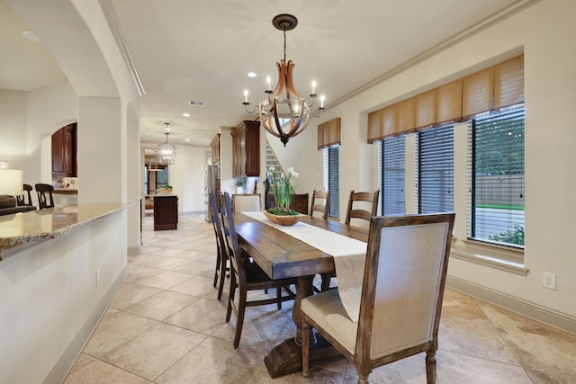 21311 Fairhaven Meadow Dr, Cypress, TX 77433 - dining space with a chandelier, arched walkways, recessed lighting, and ornamental molding