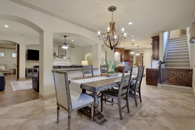 21311 Fairhaven Meadow Dr, Cypress, TX 77433 - dining room featuring a chandelier, arched walkways, crown molding, a ceiling fan, and recessed lighting