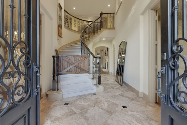 21311 Fairhaven Meadow Dr, Cypress, TX 77433 - entrance foyer featuring arched walkways, stairs, and a towering ceiling