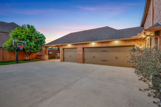 21311 Fairhaven Meadow Dr, Cypress, TX 77433 - garage at dusk featuring driveway
