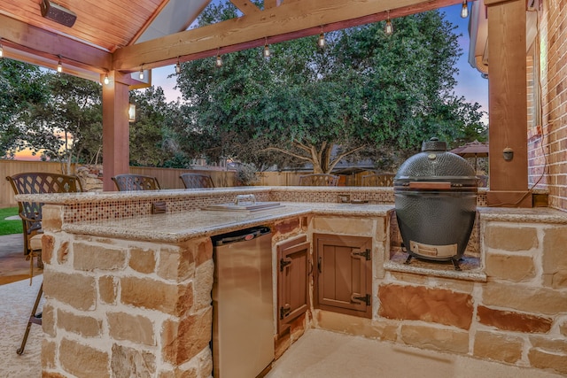 21311 Fairhaven Meadow Dr, Cypress, TX 77433 - patio terrace at dusk featuring a fenced backyard and area for grilling