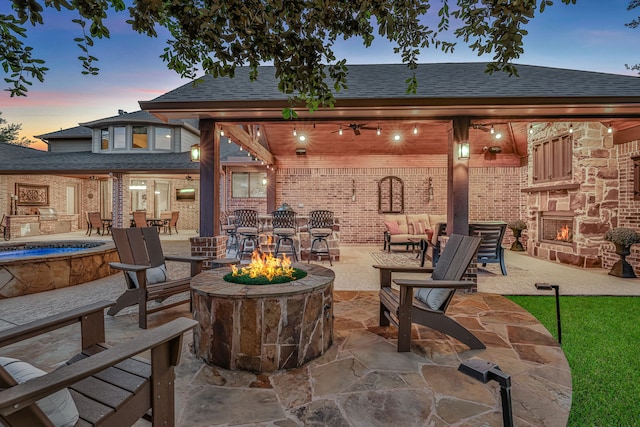 21311 Fairhaven Meadow Dr, Cypress, TX 77433 - view of patio / terrace with an outdoor fire pit, an outdoor stone fireplace, a gazebo, and ceiling fan