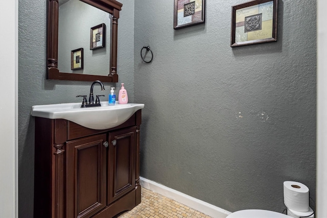 902 51st St, Galveston, TX 77551 - bathroom featuring vanity and toilet