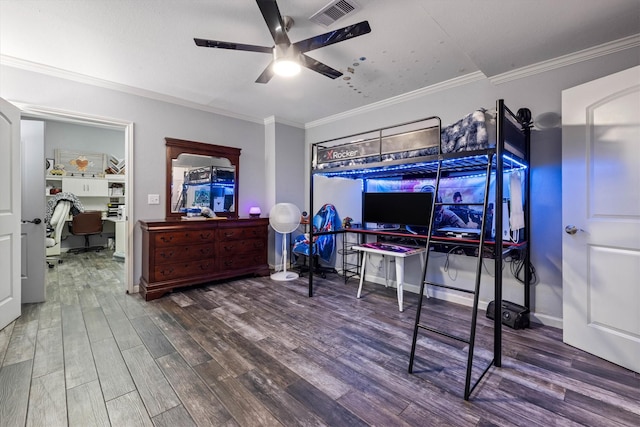 902 51st St, Galveston, TX 77551 - bedroom featuring an office area, wood finished floors, crown molding, and a ceiling fan