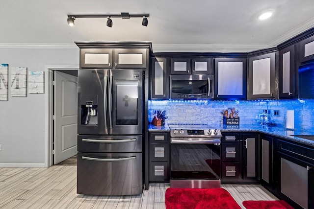 902 51st St, Galveston, TX 77551 - kitchen featuring stainless steel appliances, decorative backsplash, ornamental molding, glass insert cabinets, and dark stone countertops