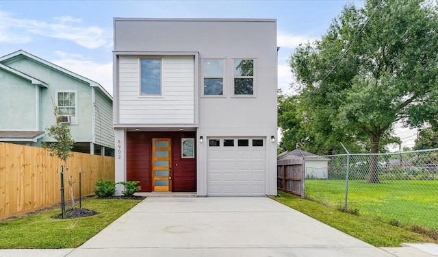6902 Apollo St, Houston, TX 77091 - view of front facade featuring driveway, an attached garage, and stucco siding
