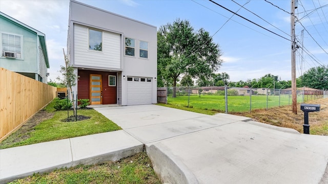 6902 Apollo St, Houston, TX 77091 - contemporary home with concrete driveway and an attached garage