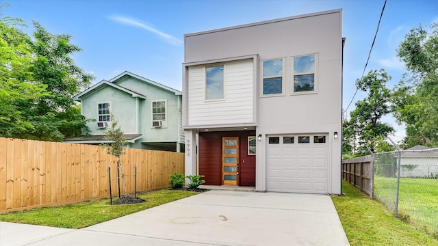 6902 Apollo St, Houston, TX 77091 - contemporary house with driveway and a garage