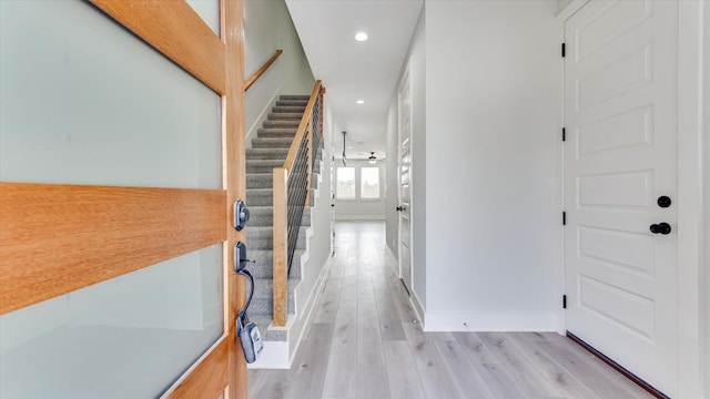 6902 Apollo St, Houston, TX 77091 - hall featuring light wood-style flooring, stairs, and recessed lighting