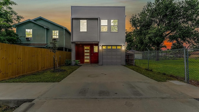 6902 Apollo St, Houston, TX 77091 - contemporary house featuring driveway and a garage